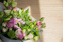 Big Bouquet Of Roses, Daisies, Lisianthus, Chrysanthemums, Unopened Buds On A White Table. Bouquet For Woman's Day, Mother's Day Or Valentine's Day.