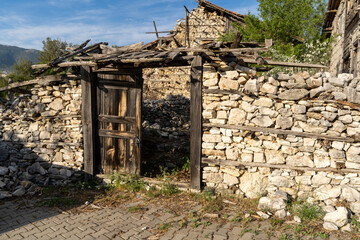 Old ruined unused wooden and stone house in the village, traditional village life and old rural architecture. Akseki - Antalya