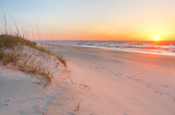 Fototapeta  - Beautiful sunrise over Kure Beach, Kure Beach, North Carolina USA. Kure Beach is a town 15 miles south of Wilmington, North Carolina