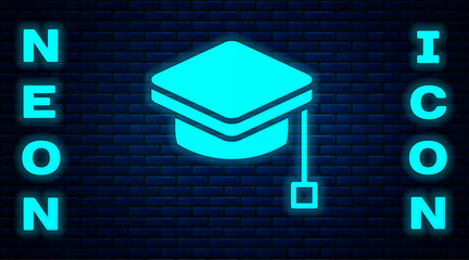 Wall Mural - Glowing neon Graduation cap icon isolated on brick wall background. Graduation hat with tassel icon. Vector