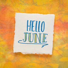 Sticker - Hello June greeting note  - handwriting on a white handmade paper against colorful marbled background, calendar concept