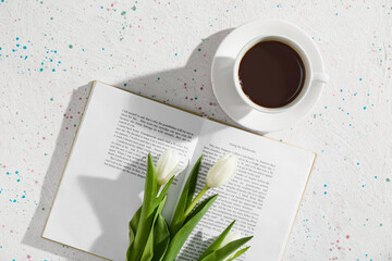 Poster - Opened book, cup of coffee and beautiful flowers on light background