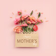 Leinwandbild Motiv mother's day concept with pink flowers over pastel background
