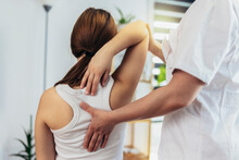 Teen Girl Having Chiropractic Back Adjustment. Osteopathy, Physiotherapy, Kinesiology. Bad Posture Correction