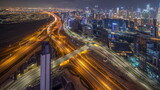 Fototapeta  - Panorama showing skyline of Dubai with business bay and downtown district night timelapse.