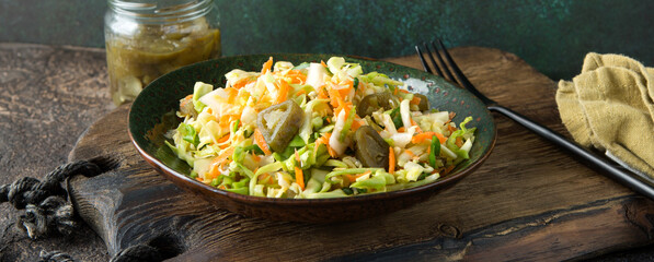 Wall Mural - bowl of coleslaw with jalapeno peppers on the table