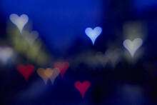 Colorful Bokeh Hearts On A Dark Background