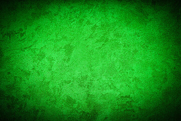 Texture of green decorative plaster or concrete with vignette.