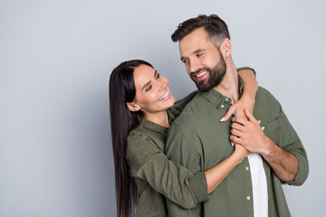 Aufkleber - Portrait of attractive cheerful couple friends hugging romance honey moon care isolated over grey pastel color background