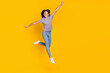 Full body photo of young pretty excited lady have fun jump up fly isolated over yellow color background