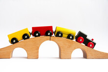 Wooden Toy Train Crossing Track Bridge. Copy Space Concept