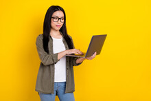 Photo Of Positive Emotion Concentrated Office Worked Girl Research Information Isolated On Yellow Color Background