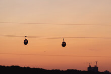 A Silhouette Of The Funicular Against The Orange Sunset Sky