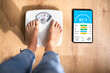 Smart Weight Scale With Wireless Tablet App. Woman Standing