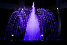 Violet Color Water Fountain At Night
