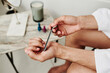 © AnnaStills - Close-up of man polishing his fingernails with file after bath procedure