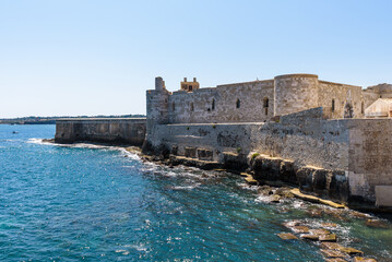 Wall Mural - The Maniace Castle in the island of Ortigia. It was built during the Swabian period by Emperor Frederick II of Swabia. It features a decorated portal, arches, towers, a banquet room and a lighthouse.