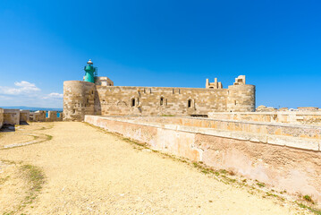 The Maniace Castle in the island of Ortigia. It was built during the Swabian period by Emperor Frederick II of Swabia. It features a decorated portal, arches, towers, a banquet room and a lighthouse.