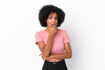 Wall Mural - Young African American woman isolated on white background having doubts