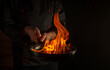 © Віталій Б. - Professional chef cooking food in pan with fire flame on dark background. Restaurant and hotel service concept