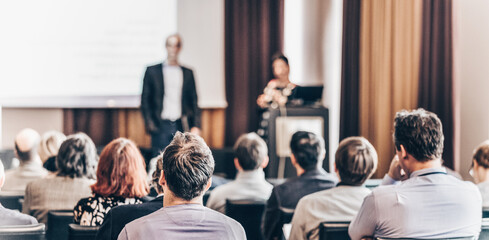Poster - speaker giving a talk at business meeting. audience in the conference hall. business and entrepreneu