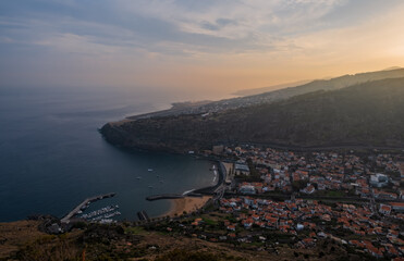 Wall Mural - The town of Machico on Madeira Island at sunset. Panoramic top view from the mountain. October 2021