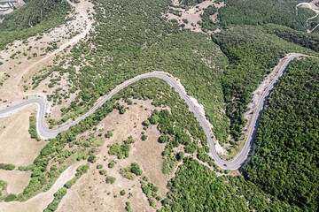 Meandering serpentine road in the mountain. Aerial view. Copter, drone view