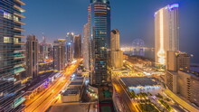 Panoramic View Of The Dubai Marina And JBR Area And The Famous Ferris Wheel Aerial Night To Day Timelapse