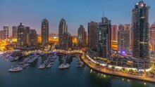 Luxury Yacht Bay In The City Aerial Night To Day Timelapse In Dubai Marina