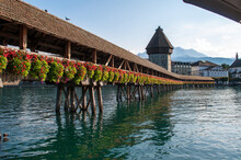 Lucerne, Switzerland - Old Wooden Bridge Over The River Decorated With Flowers