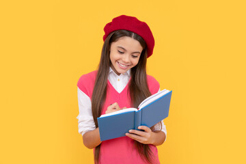 Canvas Print - happy teen school girl in french beret making notes in planner notepad or notebook, writing