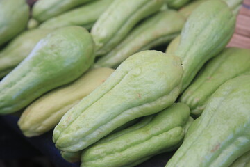 Wall Mural - salvador, bahia, brazil - april 30, 2022: chayote for sale on display at a stall at the Sao Joaquim fair in the city of Salvador.