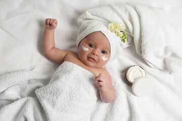 cute little baby with cream on face, top view