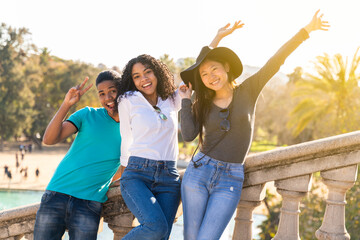 Group of multiracial young friends on vacation visiting a landmark.