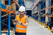 © Dusan Petkovic - A warehouse supervisor scrolling on tablet.