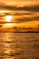 Wall Mural - sunset time over sea or ocean with island.
