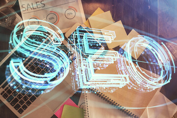 Aufkleber - Double exposure of SEO drawing over study table background with computer. Concept of search. Top view.