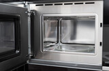 Fototapeta Nowy Jork - new clean stainless microwave built in with grill. modern kitchen appliance. selective focus