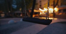Empty swing moving at the night