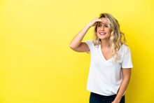 Young Brazilian Woman Isolated On Yellow Background Looking Far Away With Hand To Look Something