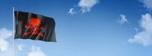 Pirate Flag, Jolly Roger Isolated On A Blue Sky. Horizontal Banner