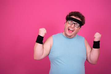 Sports and healthy lifestyle. Funny fat man on a pink background. Retro style.