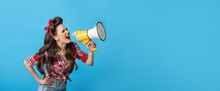 Great Shopping Offer. Agitated Young Pin Up Woman In Retro Style Outfit Shouting Into Megaphone On Blue Background
