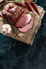 Wall Mural - Smoked ham with rosemary, garlic, and red pepper.