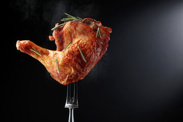 Wall Mural - Hot chicken drumstick on a fork.