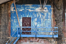 Close-up Of An Old Boathouse With Peeling Blue Wall And A Wooden Ladder, Nervi, Genoa, Liguria, Italy