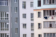 © bilanol - Architectural details of modern high apartment building facade with many windows and balconies