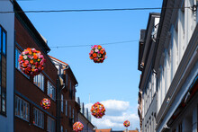 Decoration Ball Of Bright Flowers Over The Street Of The Old City.