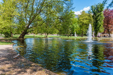 Wall Mural - Public garden of Piazza Dante in Trento during spring time. Trentino Alto Adige, northern Italy.