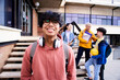 © CarlosBarquero - Close up shot of cheerful happy Asian teenage guy looking at camera smiling. Funny portrait of a young male student boy at campus university. Man laughing at high school.